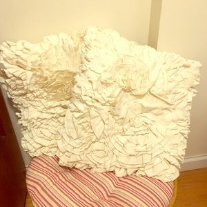 Ruffled white throw pillows